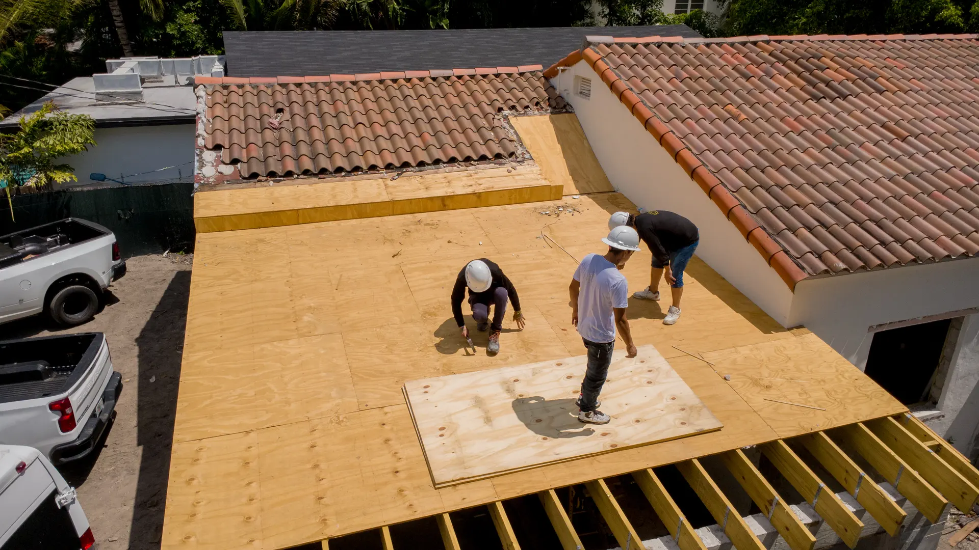 Aerial view of a residential roof reframing project in progress