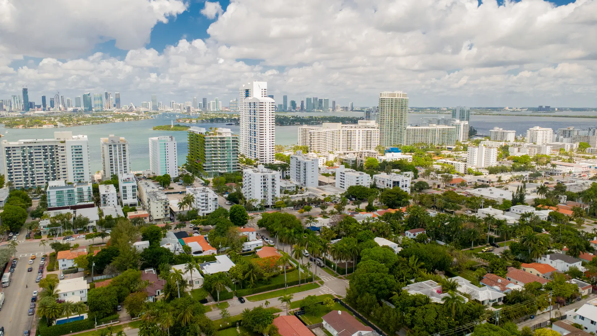 Aerial view over South Florida coastal neighborhoods toward the Miami skyline